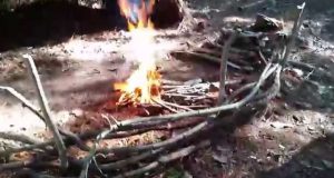 Lean-to-fire-bushcraft-primitive-camping-heat-reflector-Lean-to-shelter-survive-and-thrive-eagle-jon